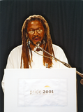 Man speaking from lectern at Pride Rally, 2001