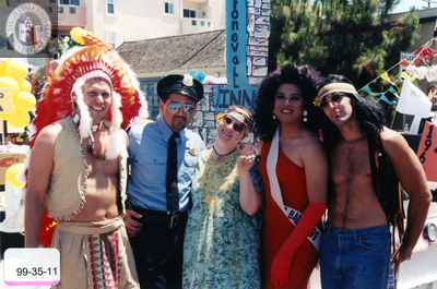 Pride parade participants in costume in front of Stonewall float, 1999
