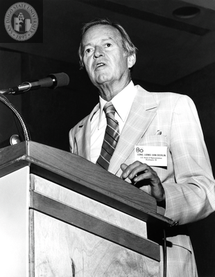 Lionel Van Deerlin speaking at a lectern, 1980