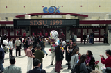Graduates and families in front of Cox Arena, 1999
