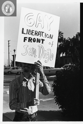 Stephen Bell with sign at Gay Liberation Front picket, 1971