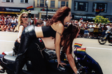 Motorcycle driver and passenger at Pride parade, 1999