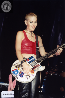 Performer playing guitar at Pride Festival, 1999
