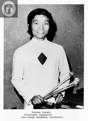 Tatsuo Sasaki smiles with percussion mallets