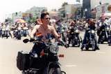 Person on motorcycle at Pride parade, 1999