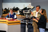 Film class with anchor desk and camera