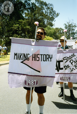 Volunteers hold flags with Pride themes, 1992