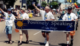 Positively Speaking of San Diego banner in Pride parade, 1999