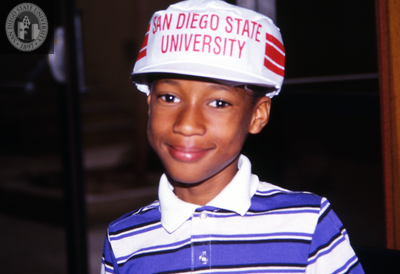 Boy with San Diego State University cap, 1990