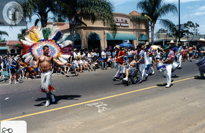 Costumed marchers with drums in Pride parade, 2000