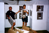 Jim Oberle and Frank Nobiletti set up booth at Pride festival, 1994