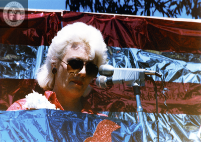 Susan Jester with county proclamation at Pride rally, 1985