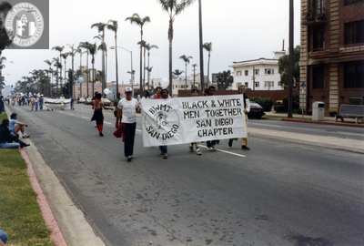 "Black and White Men Together" banner at Pride parade, 1982