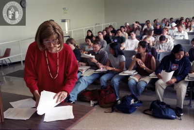 Instructor and students in lecture hall, 1996