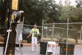 Gary walking out of fenced area at Pride festival, 1998