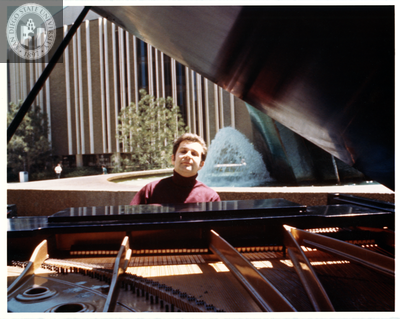 Peter Eros plays piano outside San Diego Civic Theatre, 1975