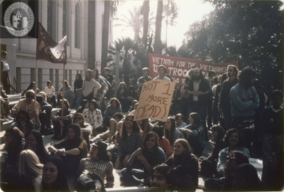 Protesters from a Los Angeles Antiwar march sit on City Hall steps, 1971