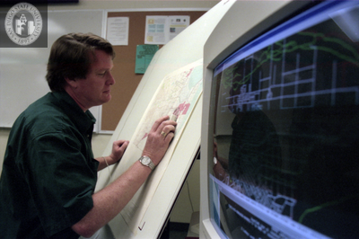 Man scans map for upload to computer, 1996