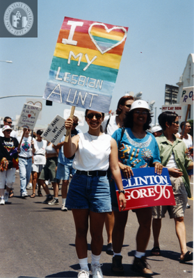 Marchers with signs at the Pride parade, 1996
