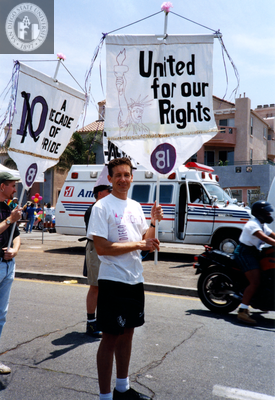 Frank Nobiletti holds Lesbian and Gay Historical Society banner, 1994