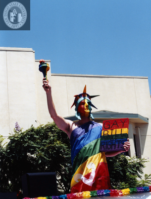 "Gay Bill of Rights" sign held by Statue of Liberty at Pride parade, 1997