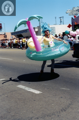 Marcher in inflatable costume in Pride parade, 1999