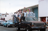 The AIDS Foundation of San Diego float heads a line of parade cars, 1991