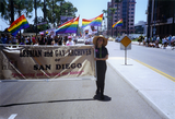 Kate Johnson holds up her end of the Lesbian and Gay Archives banner, 1992