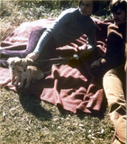 Two people with puppies at San Diego Gay-In II at Balboa Park, 1971