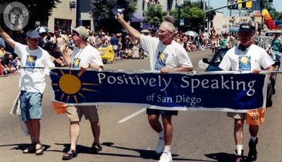 Positively Speaking of San Diego banner in Pride parade, 1999