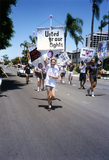 Members of the Lesbian and Gay Archives of San Diego parade group run, 1992