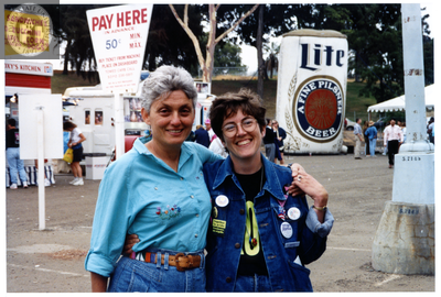Karen Marshall in front of food carts at Pride festival, 1999