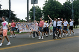 Project Life Guard banner with marchers in Pride Parade, 1991