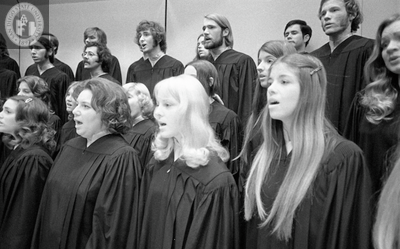 Unidentified members of a chorus sing