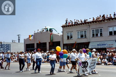 People carrying San Diego Women's Chorus banner at Pride parade, 1995