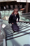 Woman climbs stairs in library dome, 1996
