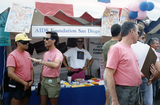 Volunteers in front of AIDS Foundation of San Diego festival booth, 1991