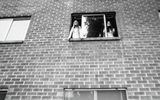 Students in the window of a dormitory