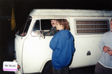 Doug Moore in a Volkswagen van with other Pride staff, 1999