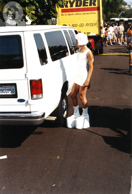 Male looking into van window at Pride parade, 1996