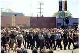 Police officers walking and waving in Pride parade, 1998