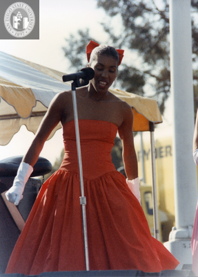 Singer in red dress at San Diego Pride Festival, 1989