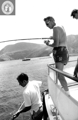 Lionel Van Deerlin fishing, with two unidentified men