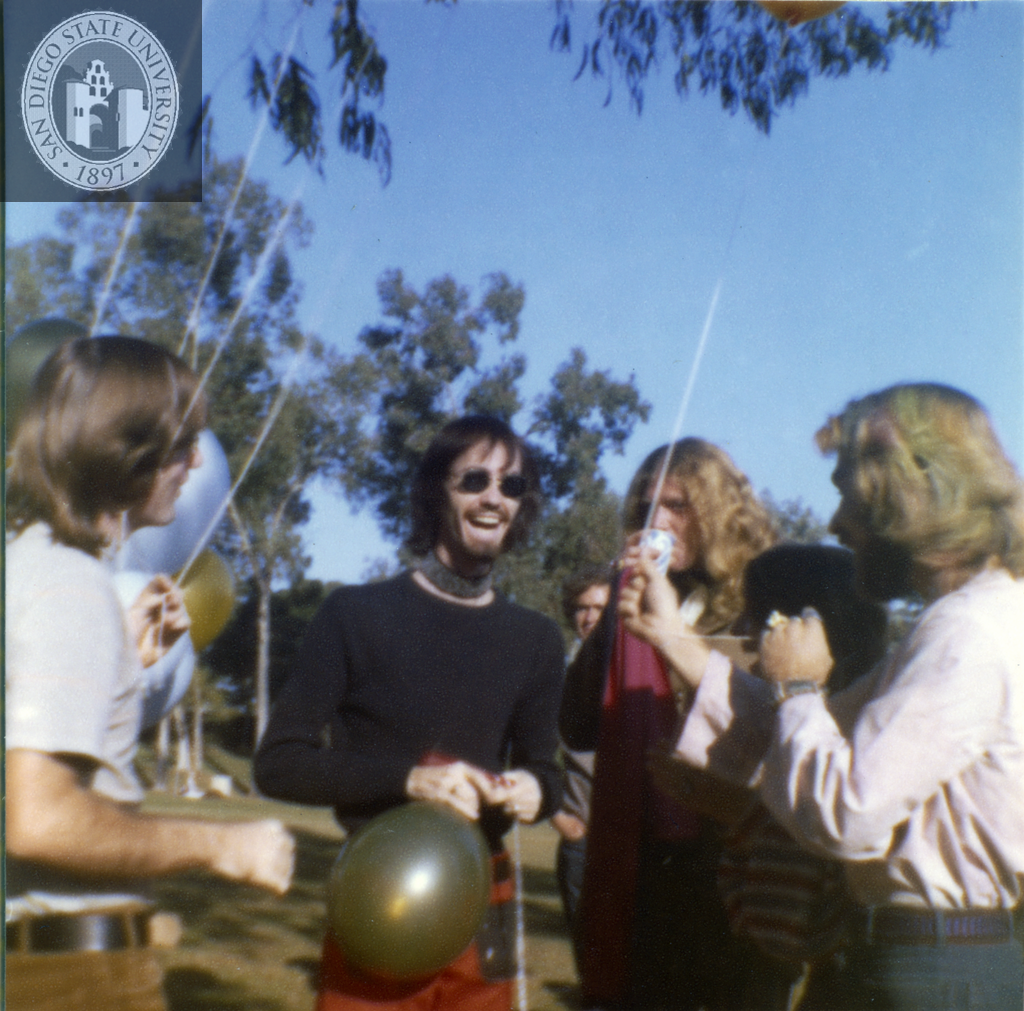 People inflate and tie balloons for the San Diego Gay-In II, 1971