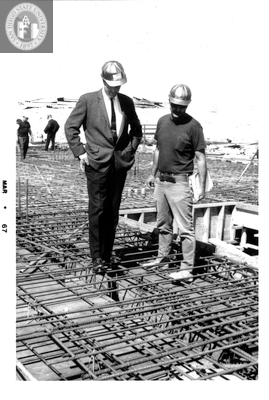 George Saunders inspects rebar, Aztec Center, 1967
