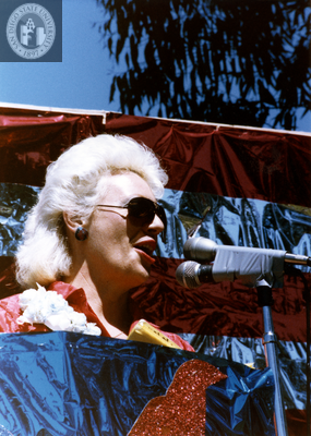 Susan Jester at presentation of county proclamation at Pride rally, 1985