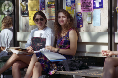 Students in front of a bulletin board, 1996