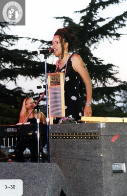 Performer with washboard onstage at Pride Festival, 2000
