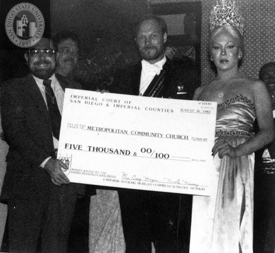 Empress Nicole and Emperor Craig presenting check, 1982