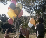 People with balloons for the Gay-In II in Balboa Park, 1971